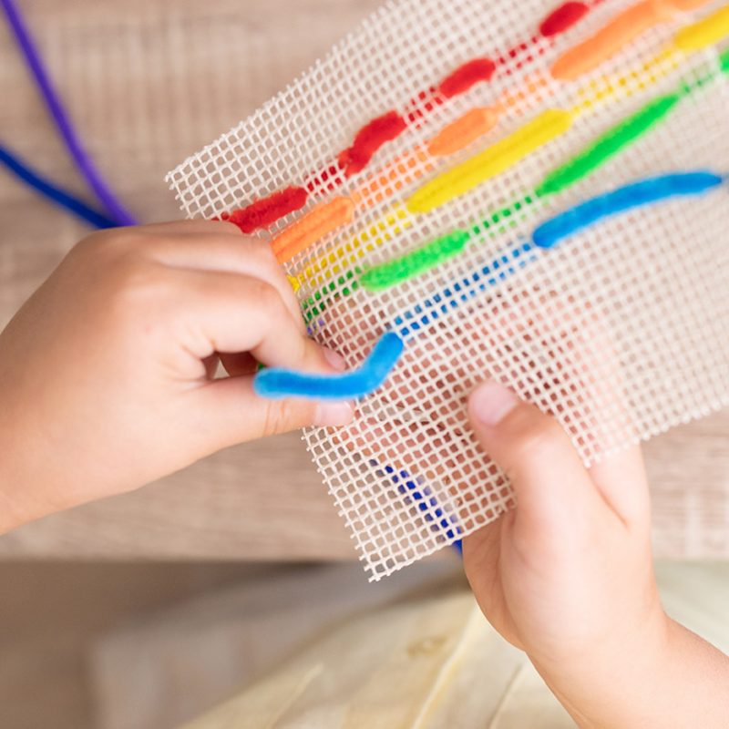 Both hands working together with pipe cleaner